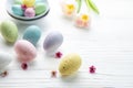 Easter eggs painted pastel colors on a white wooden background Royalty Free Stock Photo