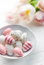 Easter eggs painted pastel colors on a white wooden background Royalty Free Stock Photo