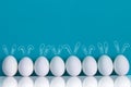 Easter eggs painted with rabbits ears and ballooons on the blue background Royalty Free Stock Photo