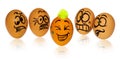 Easter eggs, painted in smiling and terrified cartoon faces look