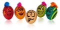 Easter eggs, painted in smiling and terrified cartoon faces look