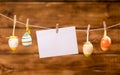 Easter eggs and paper hanging on a rope Royalty Free Stock Photo