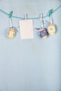 Easter Eggs and paper on a rope Royalty Free Stock Photo