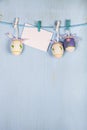 Easter Eggs and paper on a rope Royalty Free Stock Photo