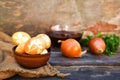 Easter eggs with pattern colored with onion peel on old wooden background