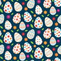 Colorful Easter eggs seamless pattern with flowers and leaves on dark blue background Royalty Free Stock Photo