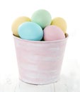 Easter eggs in pink decorative bucket