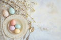 easter eggs on a plate with spoons on a table Royalty Free Stock Photo