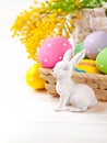 Easter eggs with rabbit and branch mimosa Royalty Free Stock Photo
