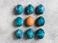 Easter eggs row painted by hand in blue color on light background Royalty Free Stock Photo