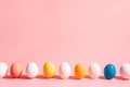 Easter eggs row on pink background with copy space, minimal composition Royalty Free Stock Photo