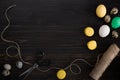 Easter eggs, scissors and thread on a black background Royalty Free Stock Photo