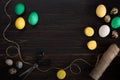 Easter eggs, scissors and thread on a black background Royalty Free Stock Photo