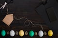 Easter eggs, scissors and thread on a black background Royalty Free Stock Photo