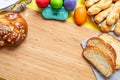 Easter eggs and tsoureki braid, greek easter sweet bread, on wood Royalty Free Stock Photo