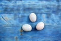 Easter eggs in soft colors on a blue shabby wooden table Royalty Free Stock Photo