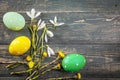 Easter eggs and spring flower snowdrop on old wooden blue board ustic style top view. Copyspace. Greeting card Royalty Free Stock Photo