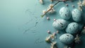 Easter eggs and spring flowers on blue background. Top view, flat lay, copy space Royalty Free Stock Photo