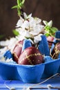Easter eggs and spring white flowers on Easter blue background with copy space Royalty Free Stock Photo