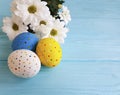 Easter eggs flowers on blue wooden festival pattern springtime Royalty Free Stock Photo