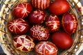 Easter eggs top view. Closeup of basket of colored red eggs, Easter holiday concept. Collection of pysanka or krashanka Royalty Free Stock Photo