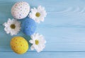 Easter eggs tradition flowers rustic blossom blue wooden background place for text Royalty Free Stock Photo