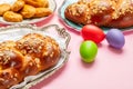 Easter eggs and tsoureki braid, greek easter sweet bread Royalty Free Stock Photo