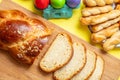 Easter eggs and tsoureki braid, greek easter sweet bread, on wood Royalty Free Stock Photo