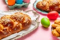 Easter eggs and tsoureki braid, greek easter sweet bread Royalty Free Stock Photo