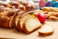 Easter tsoureki braid slices, greek easter sweet bread, on wood Royalty Free Stock Photo