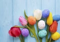 Easter eggs tulip flowers decorative vintage on blue wooden festival pattern springtime Royalty Free Stock Photo