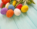 Easter eggs tulip flowers on blue wooden springtime Royalty Free Stock Photo