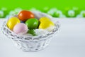 Easter eggs in white basket Royalty Free Stock Photo
