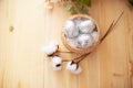 Easter eggs in the basket on white wooden background