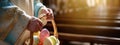 Easter eggs in a wicker basket in the hands of a priest in the interior of the church