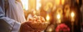 Easter eggs in a wicker basket in the hands of a priest in the interior of the church