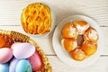 Easter Eggs in Wicker Basket and Apple Pie table top view copy space stock photo Royalty Free Stock Photo