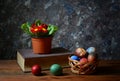 Easter eggs in wicker baskets and flowers Royalty Free Stock Photo