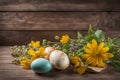 Easter eggs with wildflower on wood table background