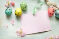 Easter eggs, willow twigs and blank paper card background Royalty Free Stock Photo