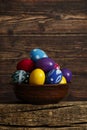 Easter eggs on wooden background. Easter eggs in the basket of wooden boards Royalty Free Stock Photo