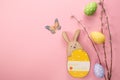 Easter eggs, wooden rabbit on yellow background. Greetings card, Happy Easters. Flat lay ,top view Royalty Free Stock Photo