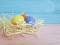 Easter eggs on a wooden straw blue handmade copy Royalty Free Stock Photo