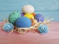 Easter eggs on a wooden straw happy handmade copy Royalty Free Stock Photo