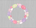 Easter eggs wreath hanging on Wooden rustic background