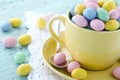 Easter eggs in a yellow cup Royalty Free Stock Photo
