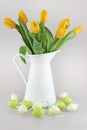 Easter eggs and yellow tullips Royalty Free Stock Photo