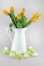 Easter eggs and yellow tullips Royalty Free Stock Photo
