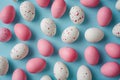 Easter Elegance: Pink and White Egg Pattern on Pastel Blue Background