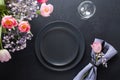 Easter elegance table setting spring pink tulip on black. Home dinner. Top view Royalty Free Stock Photo